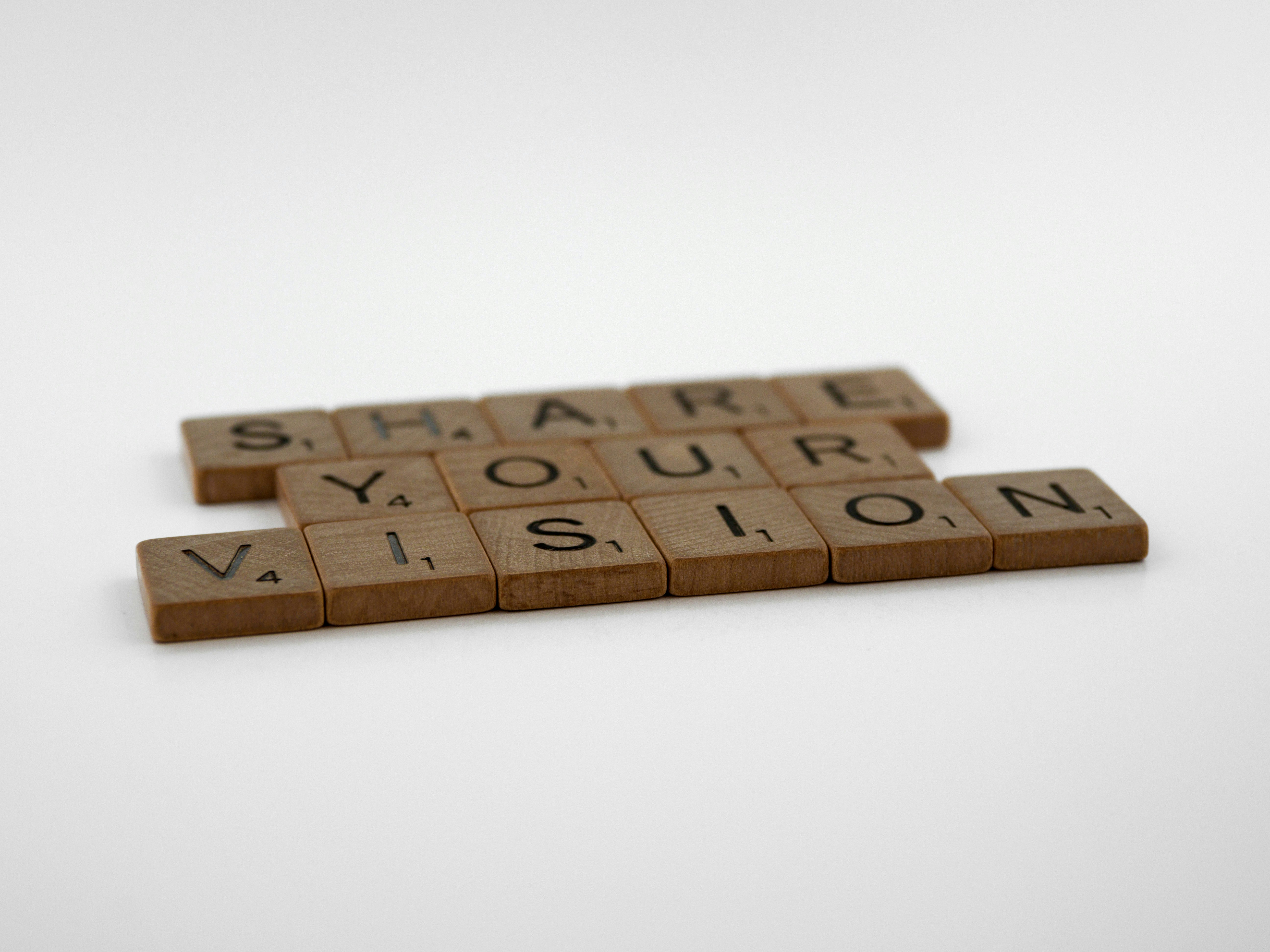 Individual wooden squares with the letters spelling out Share your vision